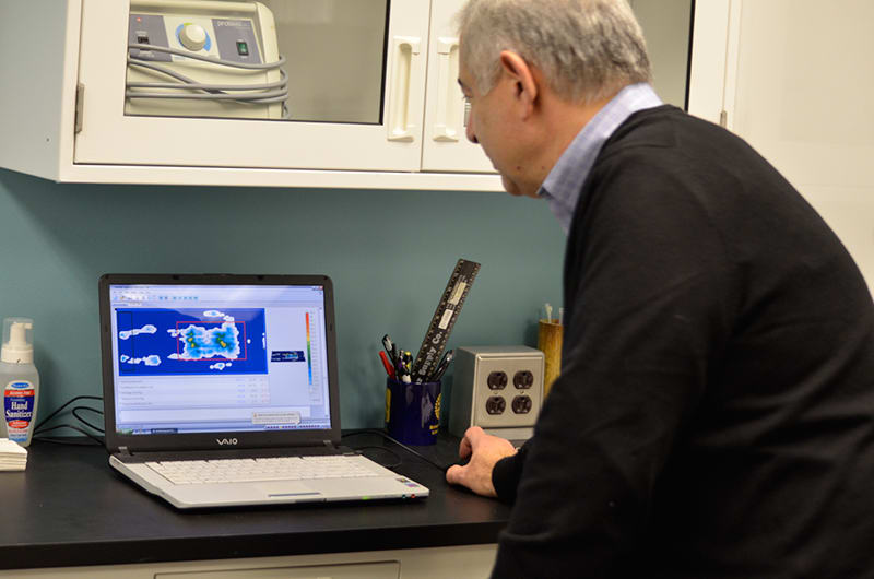 Ted Lazakis looks at pressure mapping results in Alpha Tekniko's R & D lab.