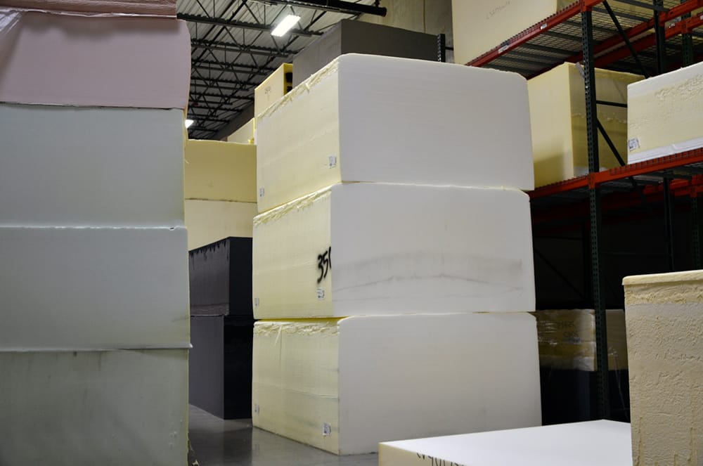 Buns of uncut foam, in various weights and densities, are ready to be transformed into custom products at Alpha Tekniko.